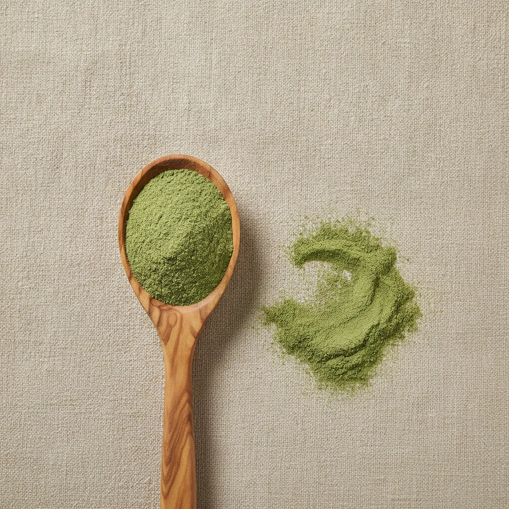 Alfalfa Leaf Powder (Medicago Sativa) | Create a luxurious, photorealistic product photograph featuring the original product naturally arranged in an elegant handcrafted wooden spoon on a soft, finely