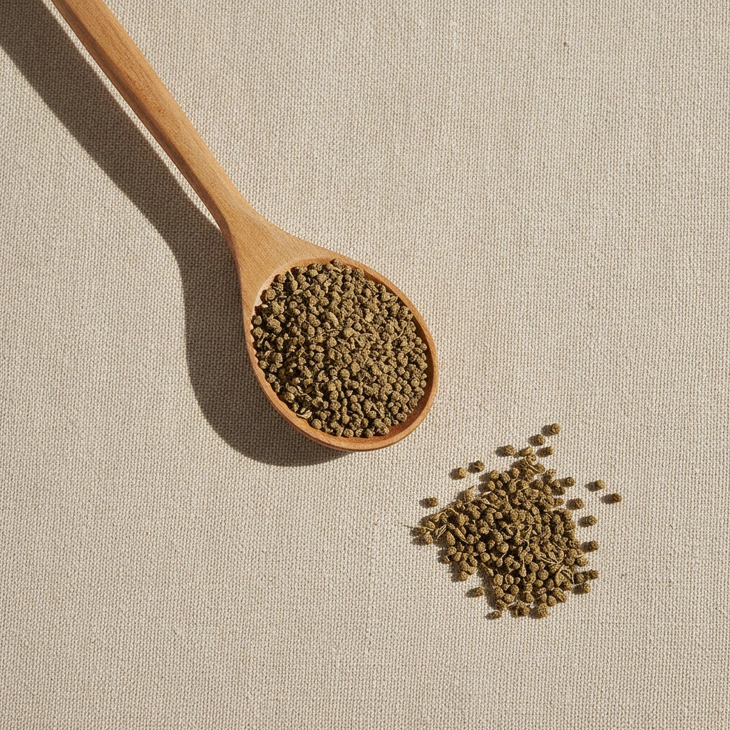 Buddleja Flower Buds (Buddleja Officinalis) | Create a luxurious, photorealistic product photograph featuring the original product naturally arranged in an elegant handcrafted wooden spoon on a soft, finely