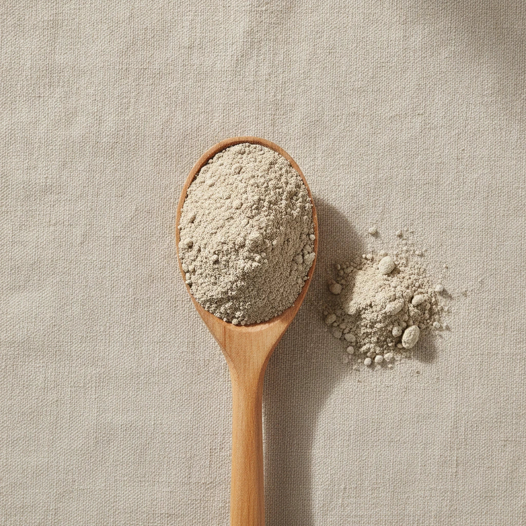 Devil's Claw Root Powder (Harpagophytum Procumbens) | Create a luxurious, photorealistic product photograph featuring the original product naturally arranged in an elegant handcrafted wooden spoon on a soft, finely
