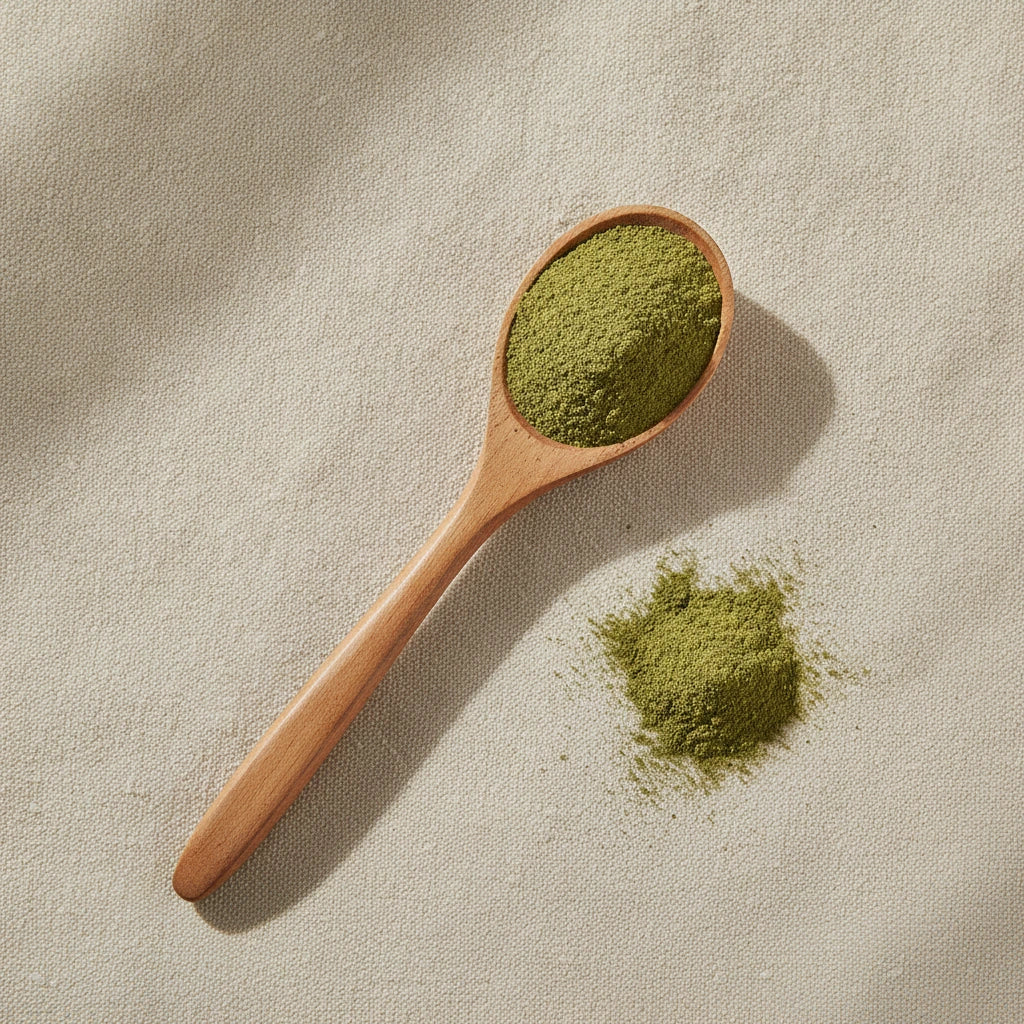 Lemon Balm Powder (Melissa Officinalis) | Create a luxurious, photorealistic product photograph featuring the original product naturally arranged in an elegant handcrafted wooden spoon on a soft, finely