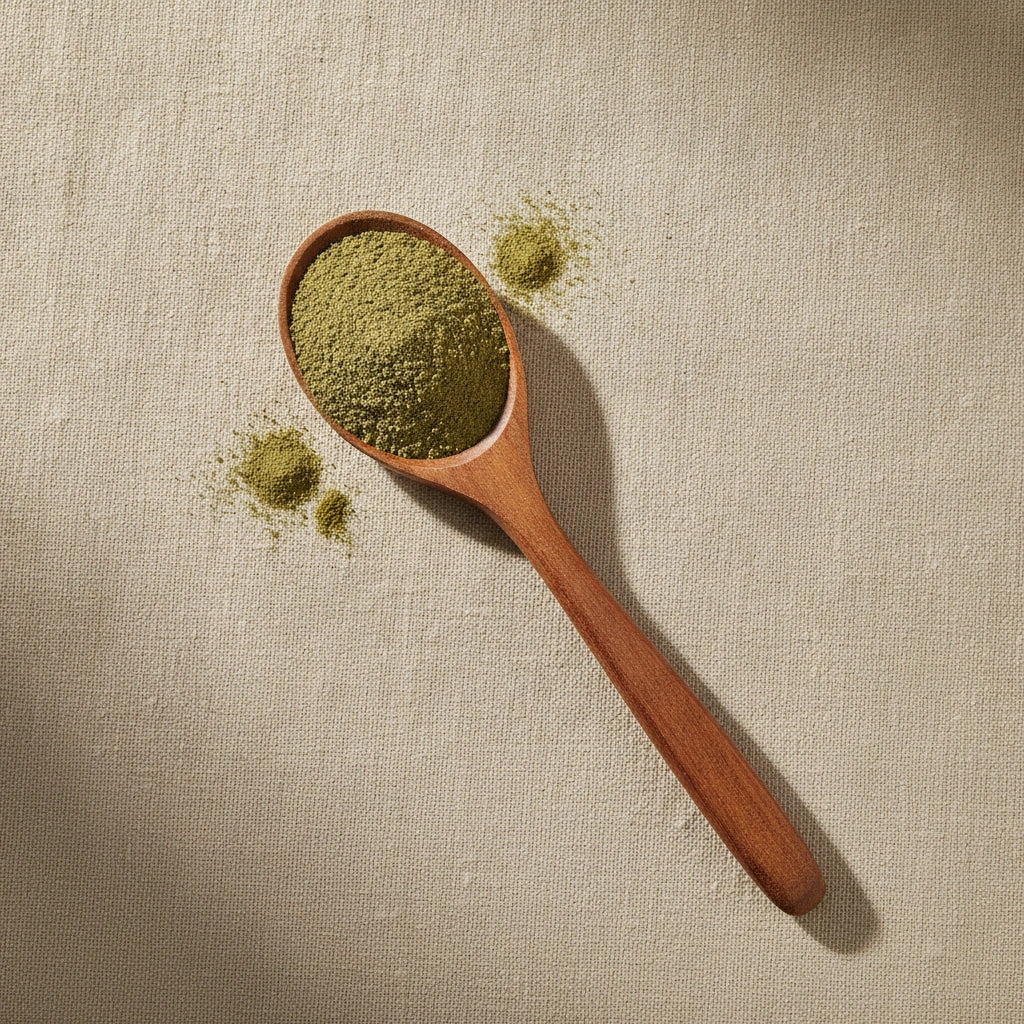 Papaya Leaf Powder (Carica Papaya) | Create a luxurious, photorealistic product photograph featuring the original product naturally arranged in an elegant handcrafted wooden spoon on a soft, finely
