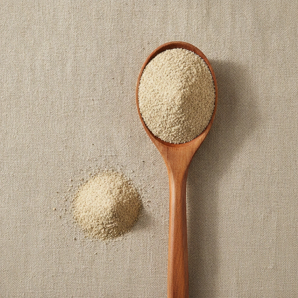 White Pepper Powder (Piper Nigrum) | Create a luxurious, photorealistic product photograph featuring the original product naturally arranged in an elegant handcrafted wooden spoon on a soft, finely
