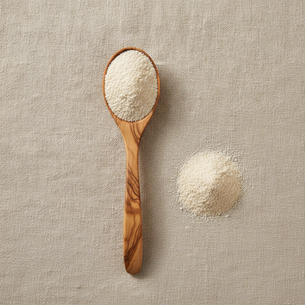 Abalone Shell Powder (Haliotis Spp.) | Create a luxurious, photorealistic product photograph featuring the original product naturally arranged in an elegant handcrafted wooden spoon on a soft, finely