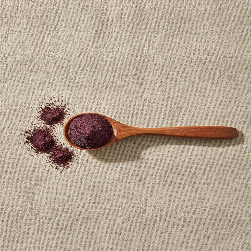 Acai Berry Extract Powder (Euterpe Oleracea) | Create a luxurious, photorealistic product photograph featuring the original product naturally arranged in an elegant handcrafted wooden spoon on a soft, finely