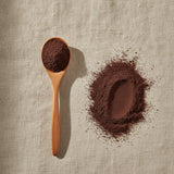 Acai Juice Powder (Euterpe Oleracea) | Create a luxurious, photorealistic product photograph featuring the original product naturally arranged in an elegant handcrafted wooden spoon on a soft, finely