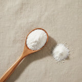 Agmatine Sulfate Powder (Agmatine Sulfate) | Create a luxurious, photorealistic product photograph featuring the original product naturally arranged in an elegant handcrafted wooden spoon on a soft, finely