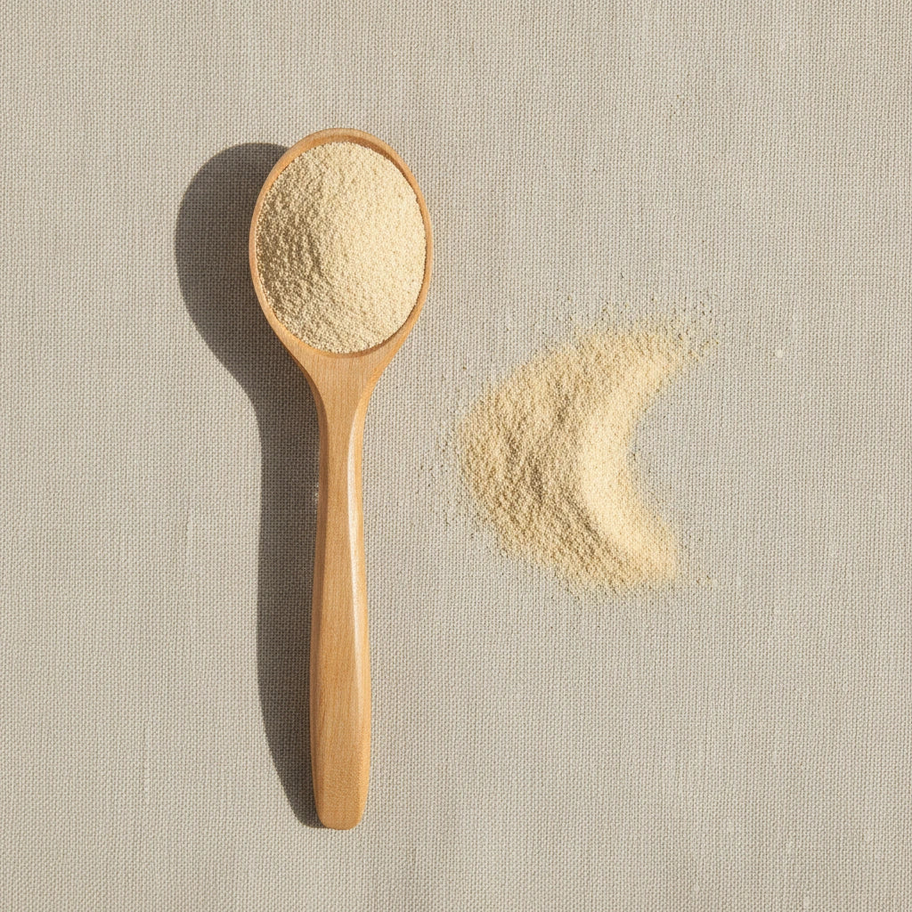 Angelica Root Powder (Angelica Archangelica) | Create a luxurious, photorealistic product photograph featuring the original product naturally arranged in an elegant handcrafted wooden spoon on a soft, finely