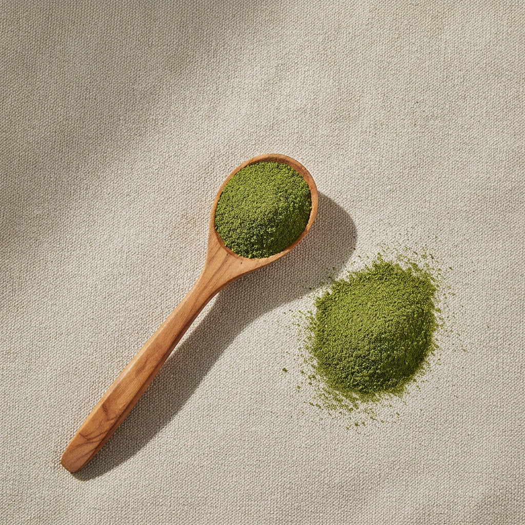 Basil Leaf Powder (Ocimum Basilicum) | Create a luxurious, photorealistic product photograph featuring the original product naturally arranged in an elegant handcrafted wooden spoon on a soft, finely