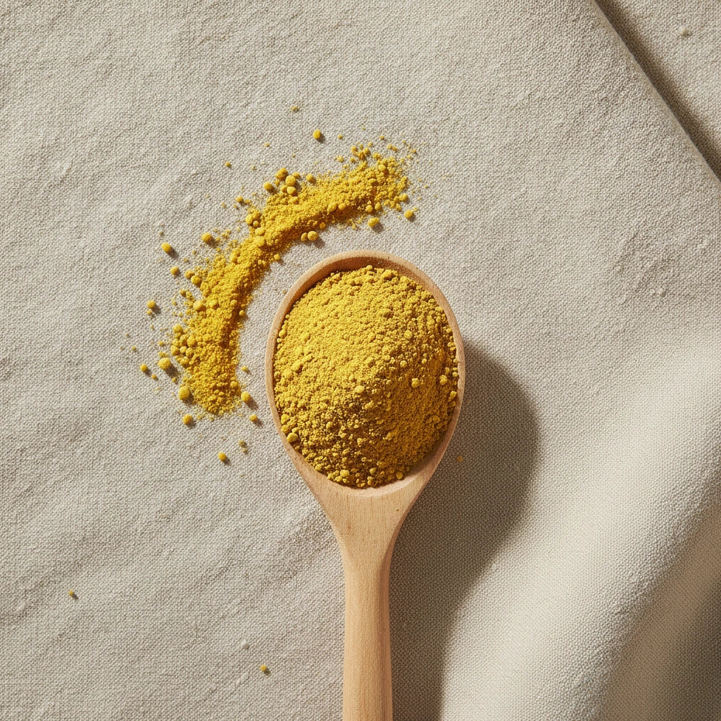 Bee Pollen Powder | Create a luxurious, photorealistic product photograph featuring the original product naturally arranged in an elegant handcrafted wooden spoon on a soft, finely