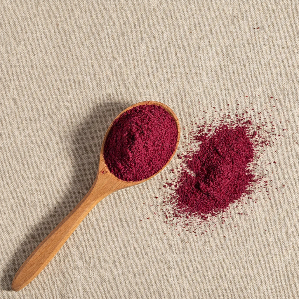 Beet Root Juice Powder (Beta Vulgaris) | Create a luxurious, photorealistic product photograph featuring the original product naturally arranged in an elegant handcrafted wooden spoon on a soft, finely
