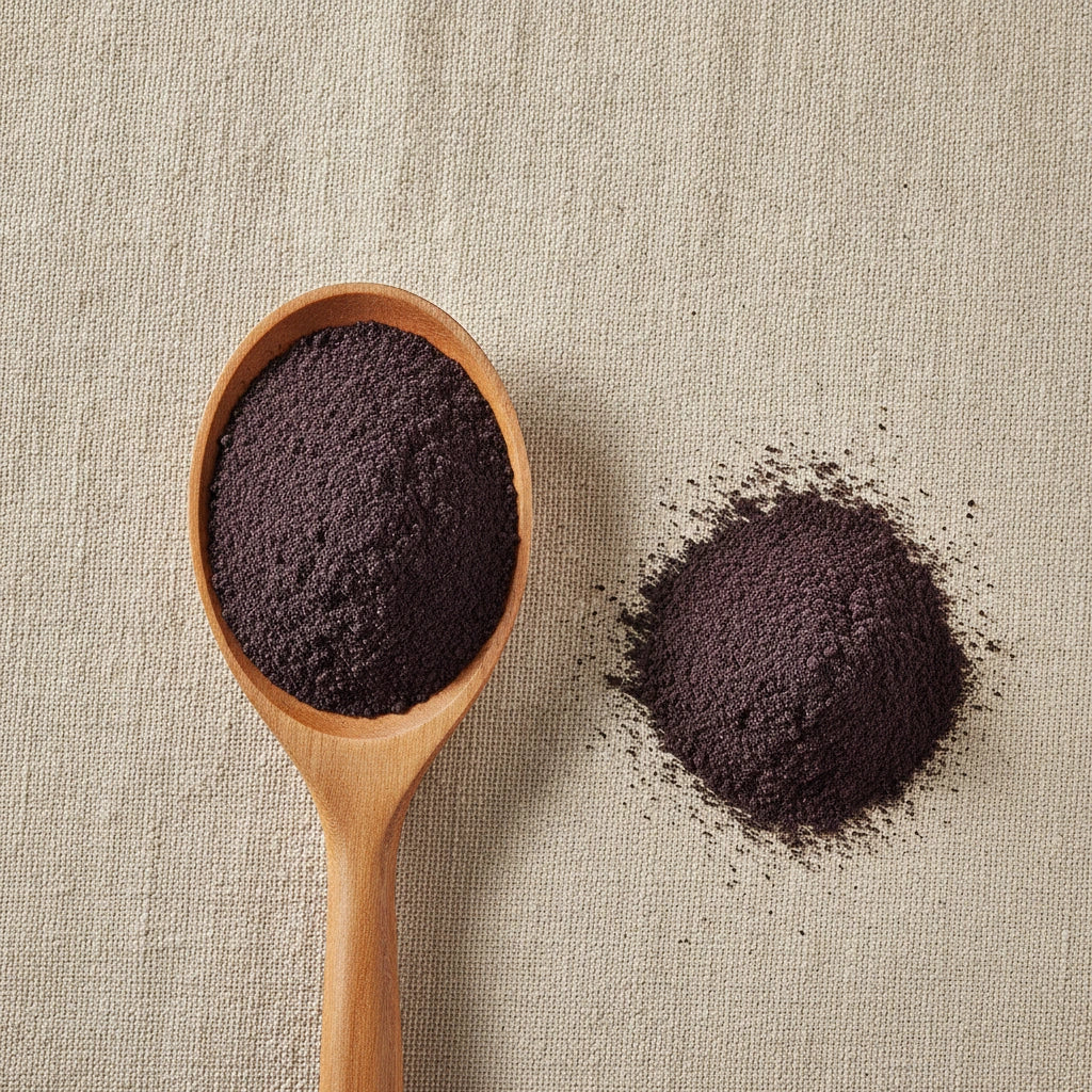 Bilberry Fruit Extract Powder (Vaccinium Myrtillus) | Create a luxurious, photorealistic product photograph featuring the original product naturally arranged in an elegant handcrafted wooden spoon on a soft, finely