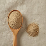 Blue Vervain Powder (Verbena Hastata) | Create a luxurious, photorealistic product photograph featuring the original product naturally arranged in an elegant handcrafted wooden spoon on a soft, finely