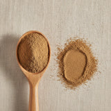 Burdock Root Powder (Arctium Lappa) | Create a luxurious, photorealistic product photograph featuring the original product naturally arranged in an elegant handcrafted wooden spoon on a soft, finely