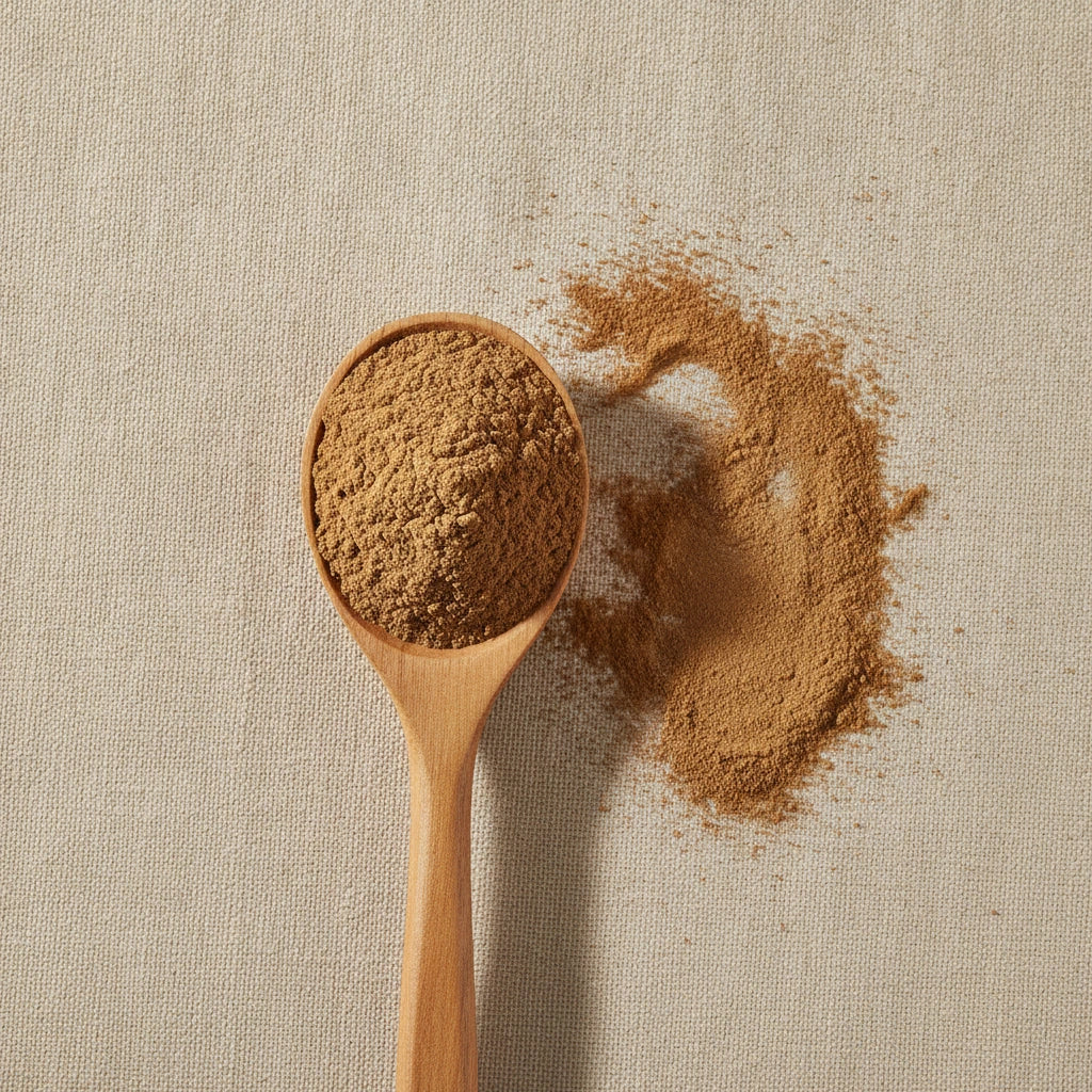 Cinnamon Powder (Cinnamomum Cassia) | Create a luxurious, photorealistic product photograph featuring the original product naturally arranged in an elegant handcrafted wooden spoon on a soft, finely