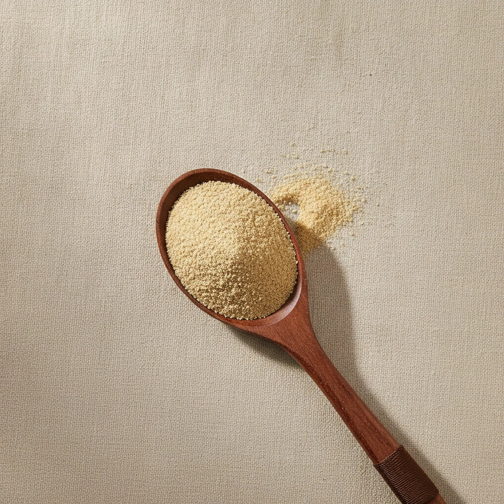 Cleanse Herbal Blend | Create a luxurious, photorealistic product photograph featuring the original product naturally arranged in an elegant handcrafted wooden spoon on a soft, finely