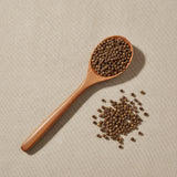 Cleistocalyx Operculatus Flower Bud Whole (Cleistocalyx Operculatus) | Create a luxurious, photorealistic product photograph featuring the original product naturally arranged in an elegant handcrafted wooden spoon on a soft, finely
