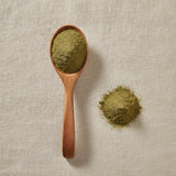 Damiana Leaf Powder (Turnera Diffusa) | Create a luxurious, photorealistic product photograph featuring the original product naturally arranged in an elegant handcrafted wooden spoon on a soft, finely