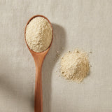 Eleuthero Root Powder (Eleutherocccus Senticosus) | Create a luxurious, photorealistic product photograph featuring the original product naturally arranged in an elegant handcrafted wooden spoon on a soft, finely