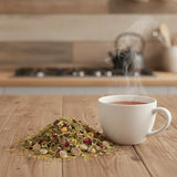 Feeling Good Flower Herbal Tea | Can you show this tea outside of the bag and bowl, on a table next to a hot tea cup in a rustic home.