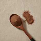 Flixweed Seed Powder (Descurainia Sophia) | Create a luxurious, photorealistic product photograph featuring the original product naturally arranged in an elegant handcrafted wooden spoon on a soft, finely