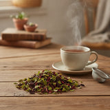 Hibiscus Mint Herbal Tea | Can you show this tea outside of the bag and bowl, on a table next to a hot tea cup in a rustic home.