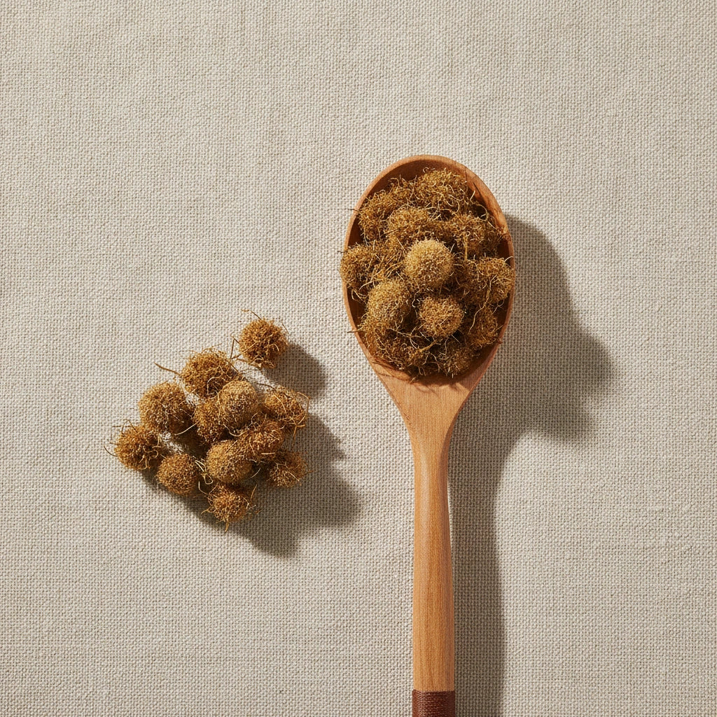 Inula Flower Whole (Inula Japonica) | Create a luxurious, photorealistic product photograph featuring the original product naturally arranged in an elegant handcrafted wooden spoon on a soft, finely