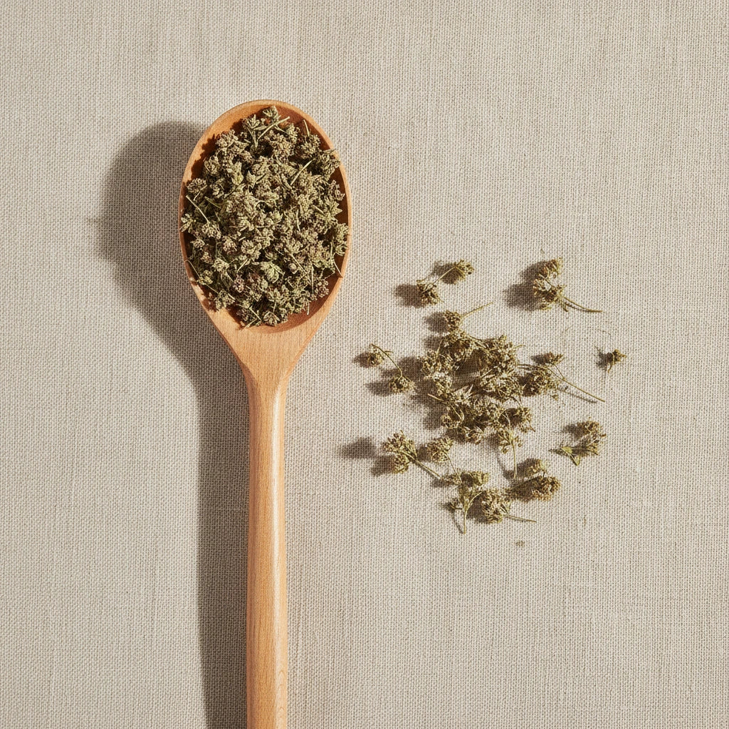 Japanese Catnip Whole (Schizonepeta Tenuifolia) | Create a luxurious, photorealistic product photograph featuring the original product naturally arranged in an elegant handcrafted wooden spoon on a soft, finely