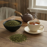 Licorice Mint Herbal Tea | Can you show this tea outside of the bag and bowl, on a table next to a hot tea cup in a rustic home.