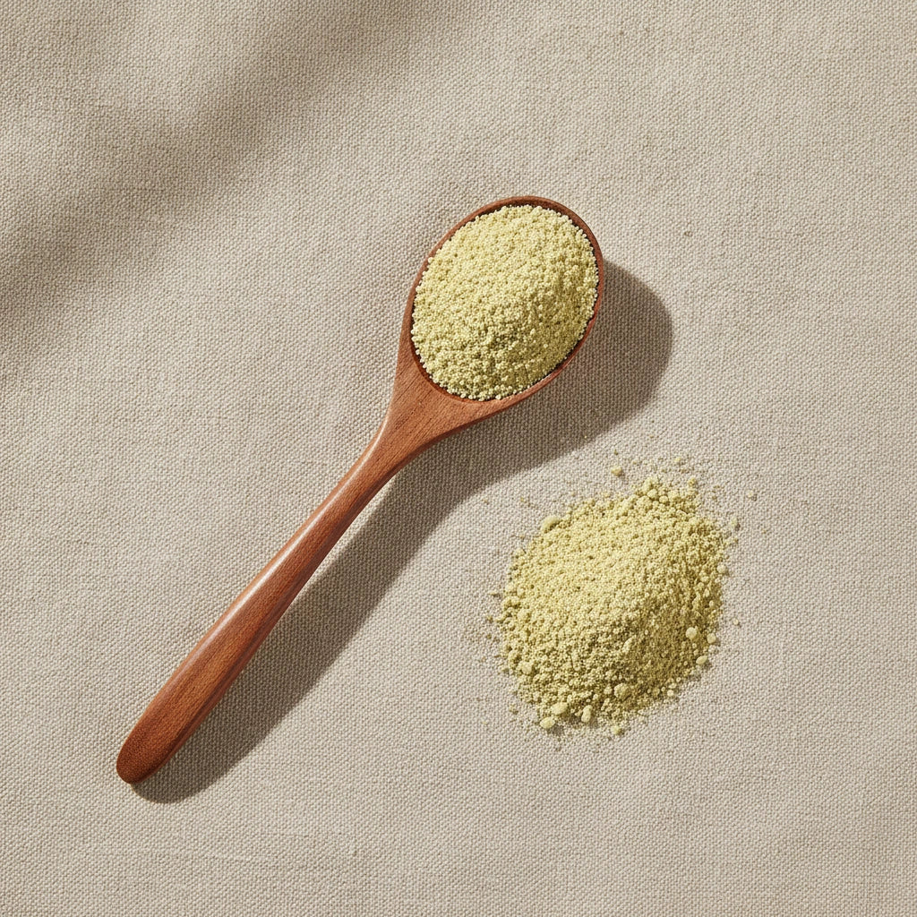 Lime Peel Powder (Citrus Aurantifolia) | Create a luxurious, photorealistic product photograph featuring the original product naturally arranged in an elegant handcrafted wooden spoon on a soft, finely