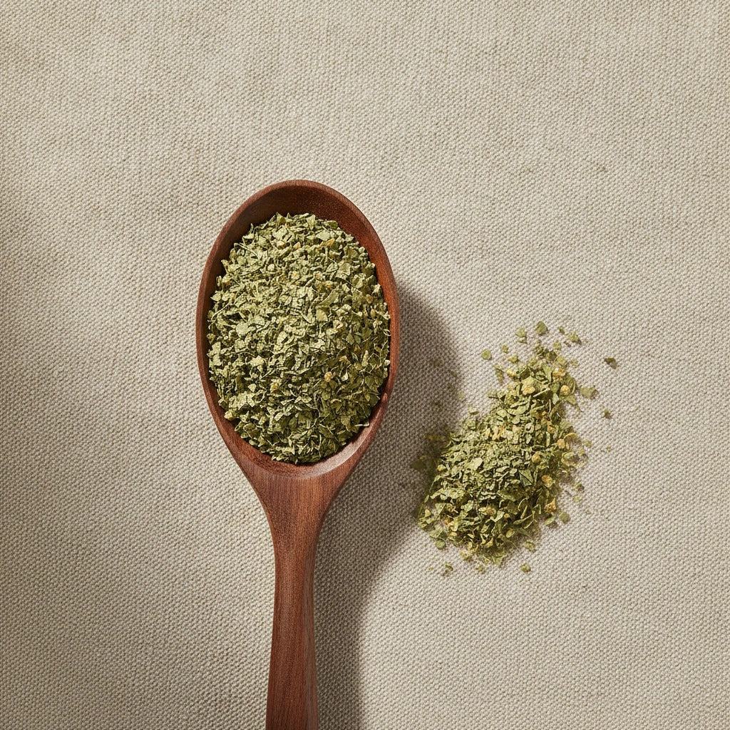 Linden Leaf & Flower Cut (Tilia Vulgaris) | Create a luxurious, photorealistic product photograph featuring the original product naturally arranged in an elegant handcrafted wooden spoon on a soft, finely