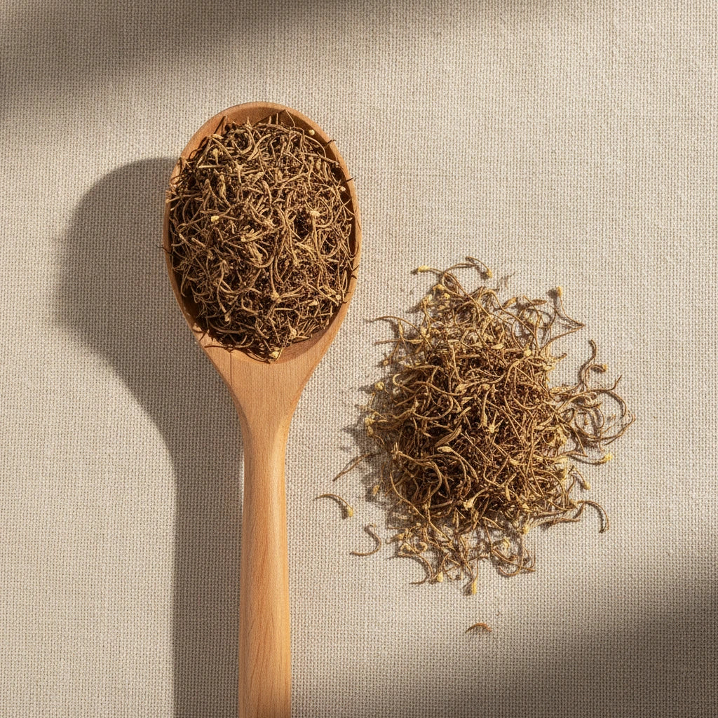 Lotus Stamen Whole (Nelumbo Nucifera) | Create a luxurious, photorealistic product photograph featuring the original product naturally arranged in an elegant handcrafted wooden spoon on a soft, finely