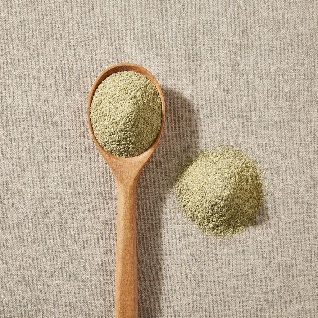 Oatstraw Powder (Avena Sativa) | Create a luxurious, photorealistic product photograph featuring the original product naturally arranged in an elegant handcrafted wooden spoon on a soft, finely
