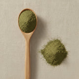 Passion Flower Herb Powder (Passiflora Incarnata) | Create a luxurious, photorealistic product photograph featuring the original product naturally arranged in an elegant handcrafted wooden spoon on a soft, finely