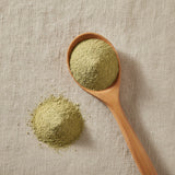 Prodigiosa Herb Powder (Brickellia Grandiflora) | Create a luxurious, photorealistic product photograph featuring the original product naturally arranged in an elegant handcrafted wooden spoon on a soft, finely