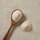 Rhodiola Root Extract Powder (Rhodiola Rosea) | Create a luxurious, photorealistic product photograph featuring the original product naturally arranged in an elegant handcrafted wooden spoon on a soft, finely