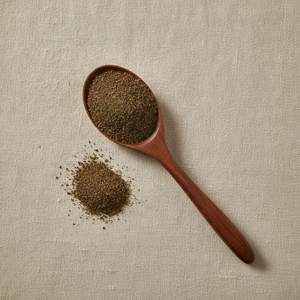 Spikemoss Powder (Selaginella Involvens) | Create a luxurious, photorealistic product photograph featuring the original product naturally arranged in an elegant handcrafted wooden spoon on a soft, finely