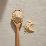 Stone Root Powder (Collinsonia Canadensis) | Create a luxurious, photorealistic product photograph featuring the original product naturally arranged in an elegant handcrafted wooden spoon on a soft, finely