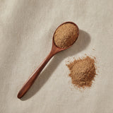 Valerian Root Powder (Valeriana Officinalis) | Create a luxurious, photorealistic product photograph featuring the original product naturally arranged in an elegant handcrafted wooden spoon on a soft, finely