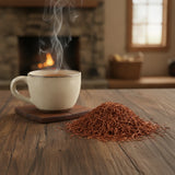 Vanilla Rooibos Red Tea (Aspalathus Linearis) | Can you show this tea outside of the bag and bowl, on a table next to a hot tea cup in a rustic home.