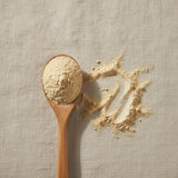 White Turmeric Powder (Curcuma Wenyujin) | Create a luxurious, photorealistic product photograph featuring the original product naturally arranged in an elegant handcrafted wooden spoon on a soft, finely