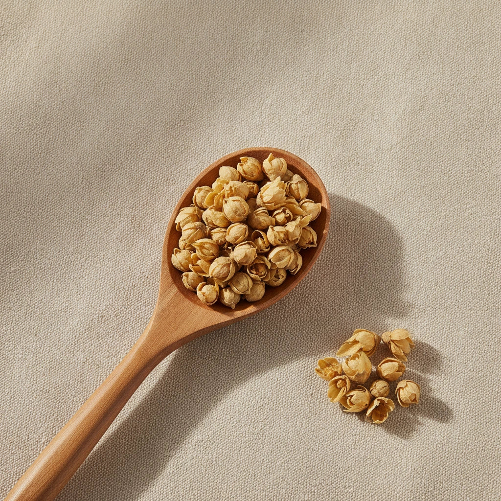 Wintersweet Flower Whole (Chimonanthus Praecox) | Create a luxurious, photorealistic product photograph featuring the original product naturally arranged in an elegant handcrafted wooden spoon on a soft, finely