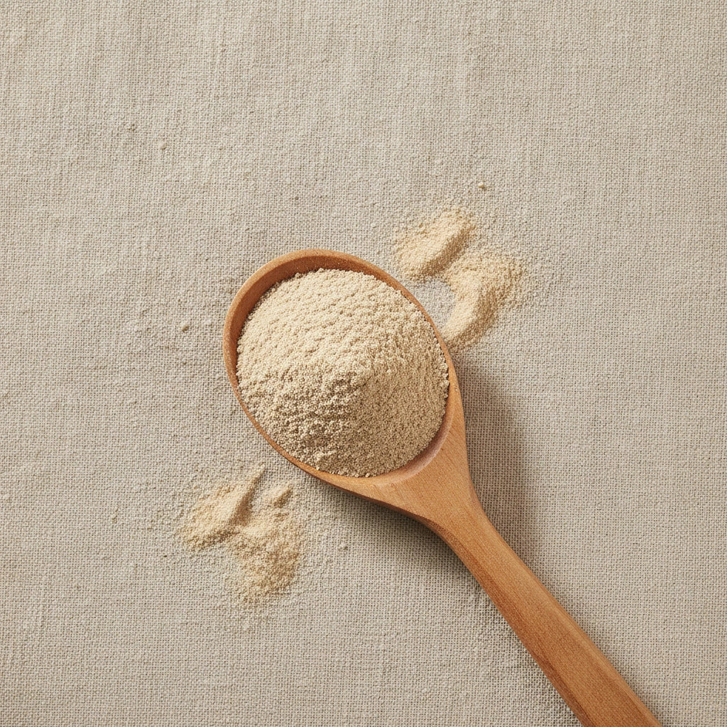 Yarrow Flowers & Herb Powder (Achillea Millefolium) | Create a luxurious, photorealistic product photograph featuring the original product naturally arranged in an elegant handcrafted wooden spoon on a soft, finely