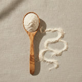 Yucca Root Powder (Yucca Schidigera) | Create a luxurious, photorealistic product photograph featuring the original product naturally arranged in an elegant handcrafted wooden spoon on a soft, finely